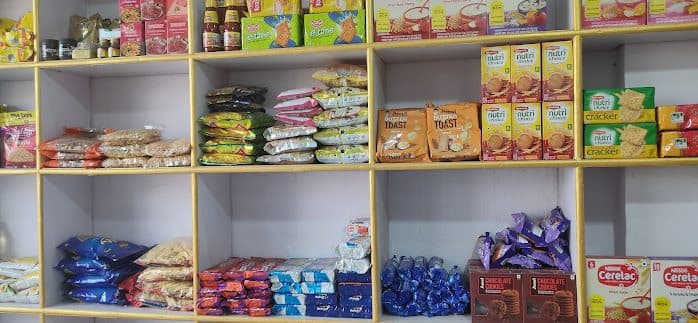 Neatly stocked shelves of groceries, biscuits and baby food at Haya Mart